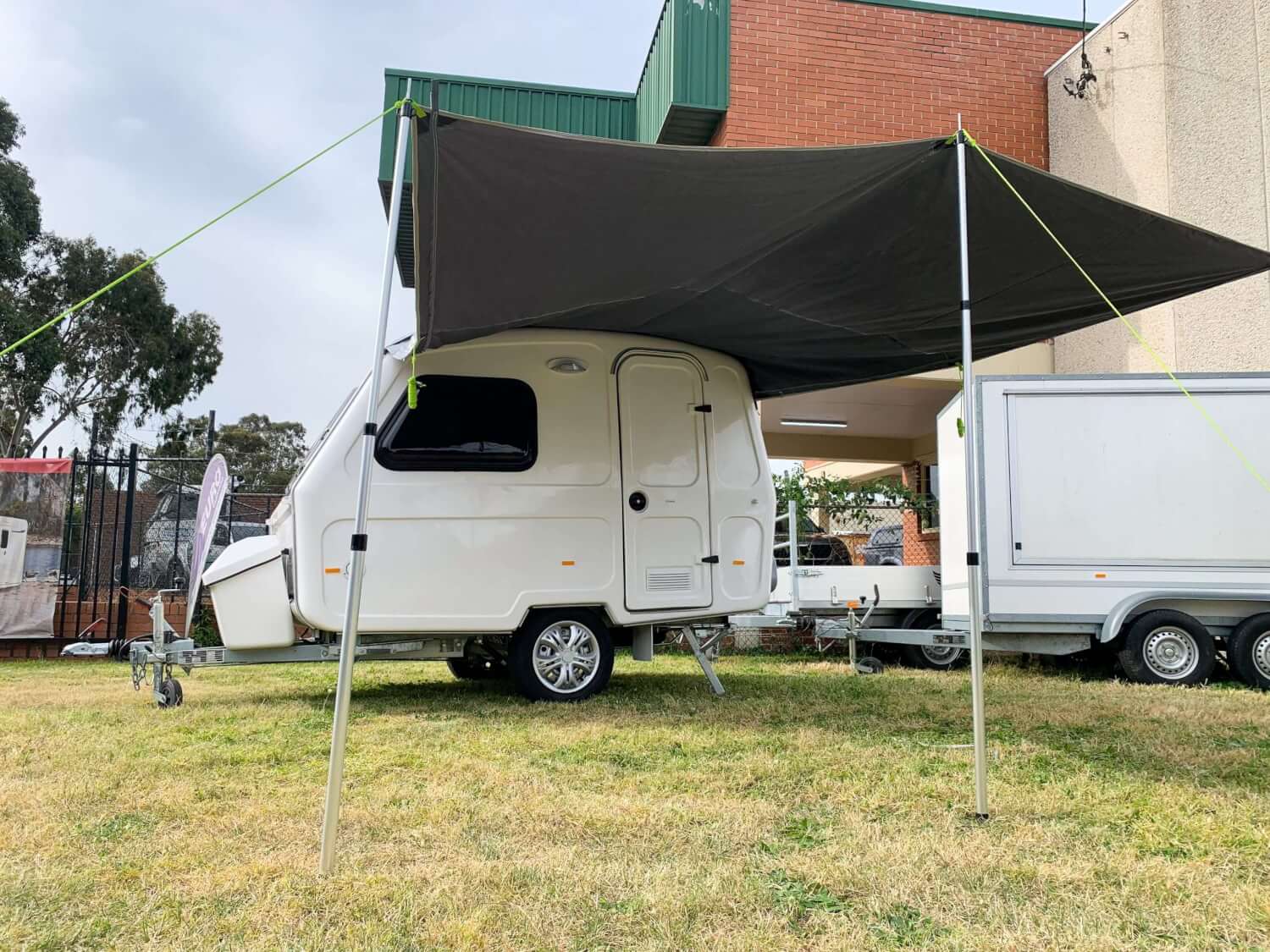 An awning displayed on a caravan on a grass land